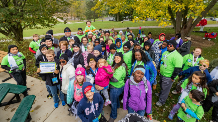 group of children and adults in a park